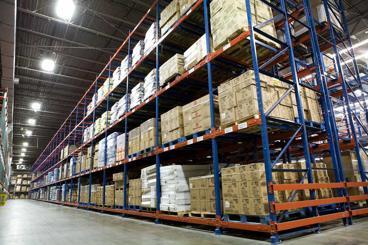 American Warehouse Equipment, Inc. - Push-Back & Drive-In Racking - Our push-back and drive-in pallet racks are engineered to help you store more in less space. Drive-in racking is ideal for high-volume, single-SKU storage, minimizing aisle requirements while maximizing capacity.Push-back racking offers similar space efficiency but adds flexibility, allowing easy access to multiple SKUs with a dynamic cart system that rolls pallets forward for faster, safer picking.